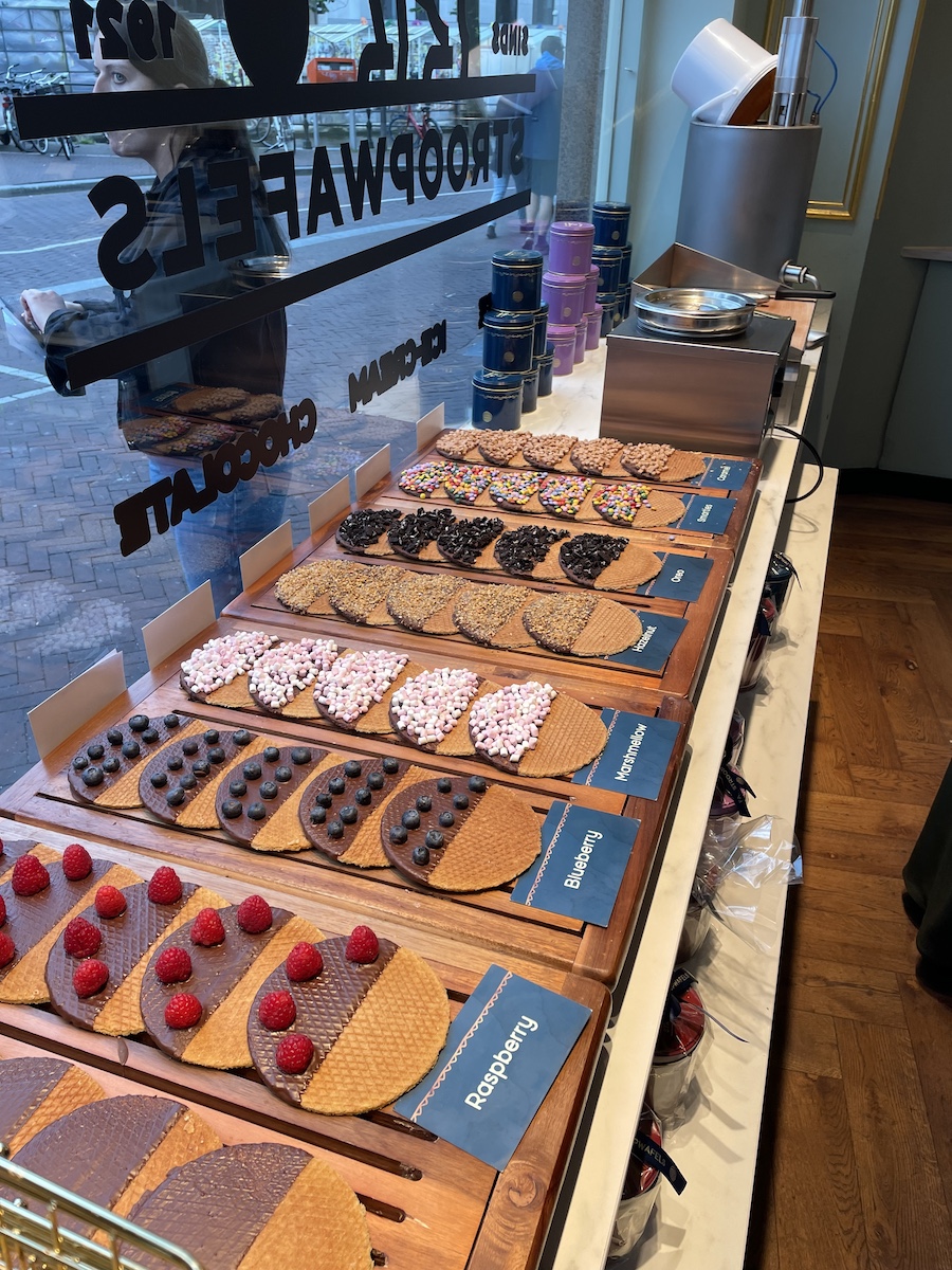 A variety of toppings on stroopwafels, layed out on counter