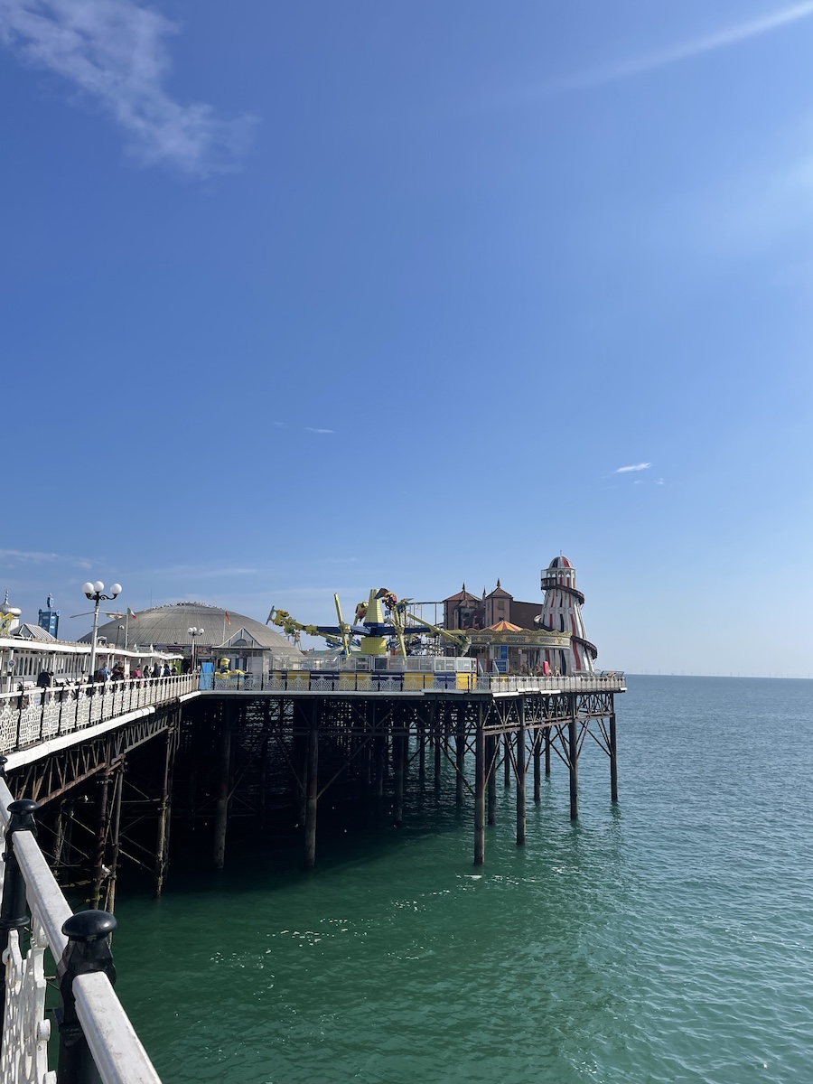 Elevated pier on a dock with carnival rides