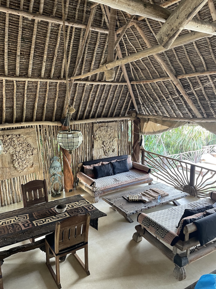 The dining table and couches in main room of our resort stay