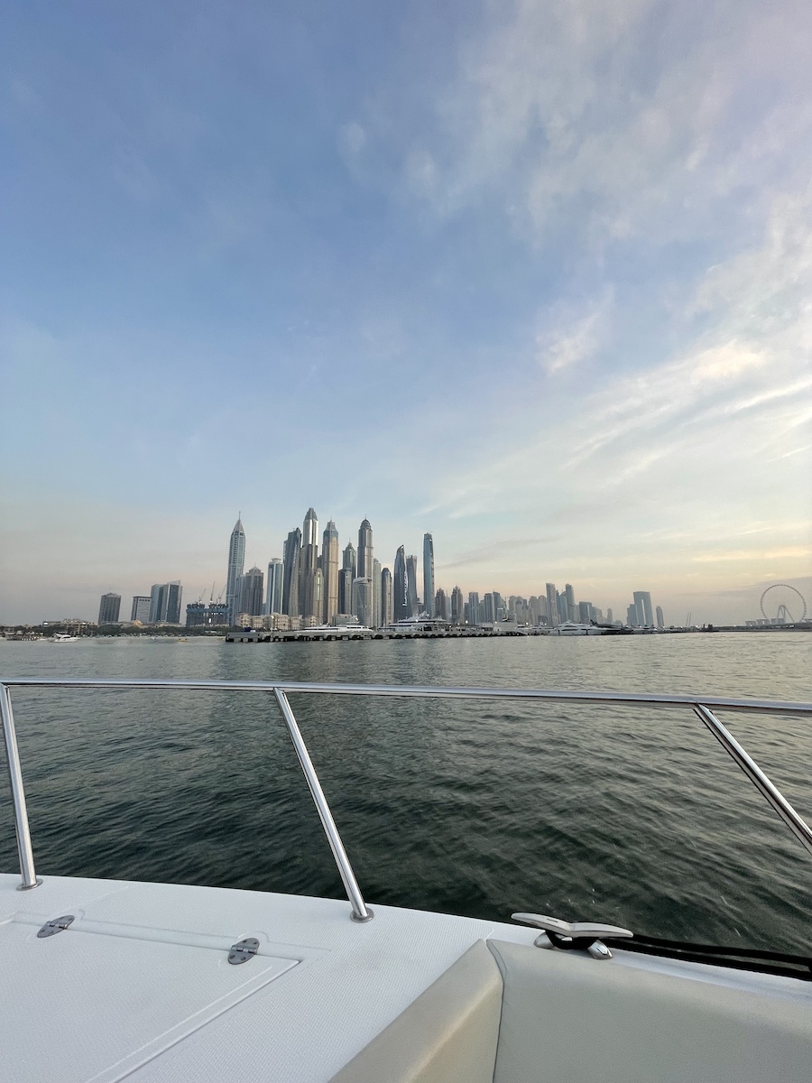 Skyscrapers across water while on a yacht