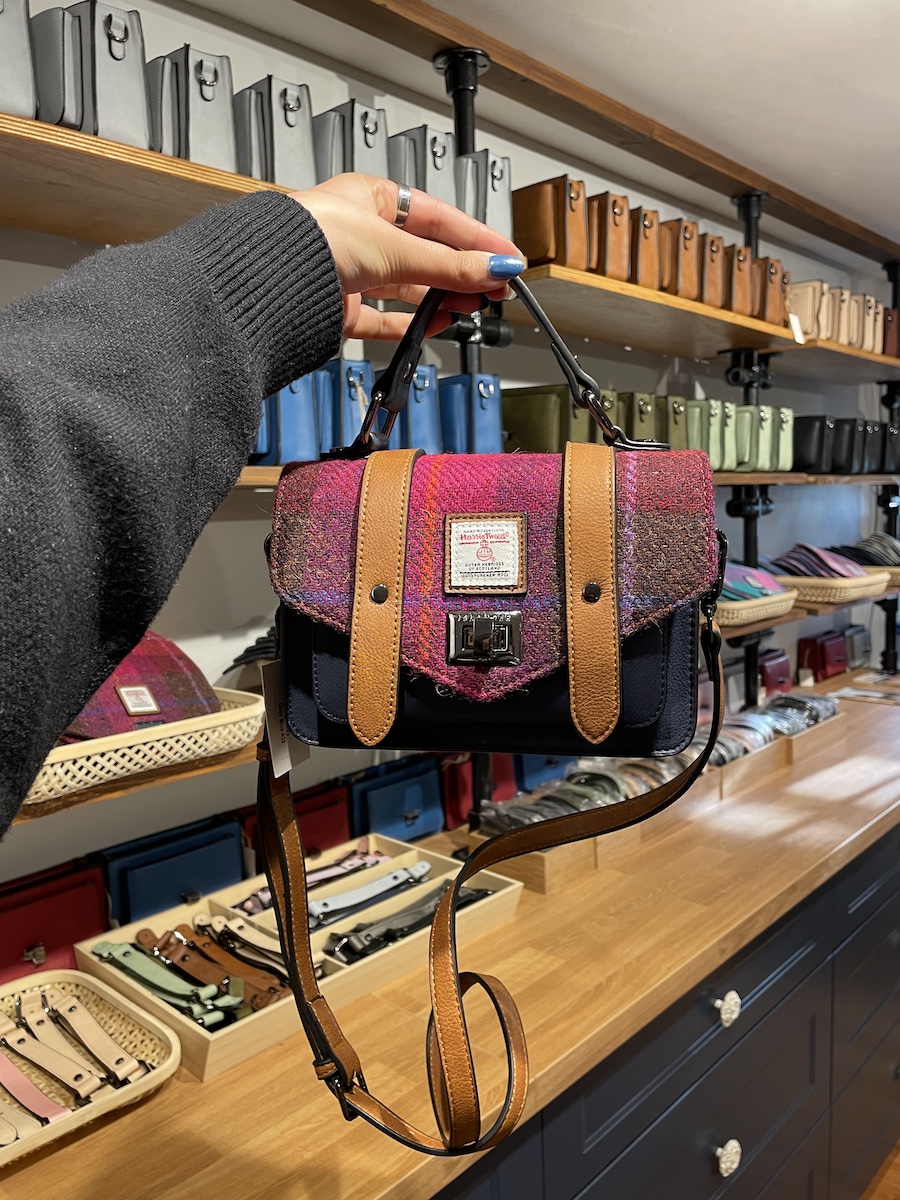 Handmade navy blue purse with pink flap and brown straps