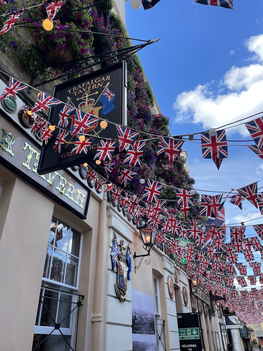 Rows of United Kingdom flags in front of pub