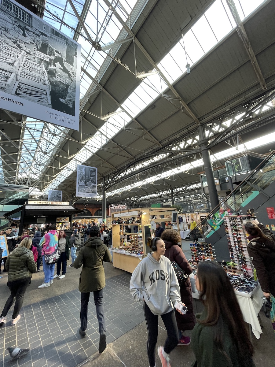 Entrance of stalls in market under clear rooftop building