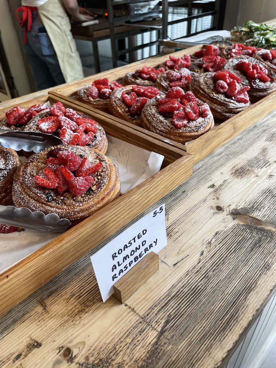 Trays of Almond Raspberry pastry on cafe counter