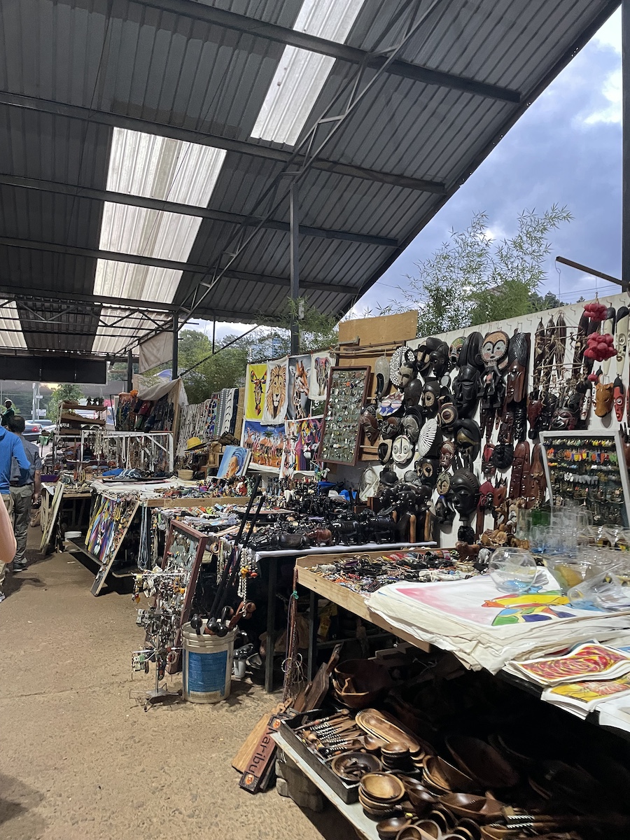 Tables full of African souvenirs set up