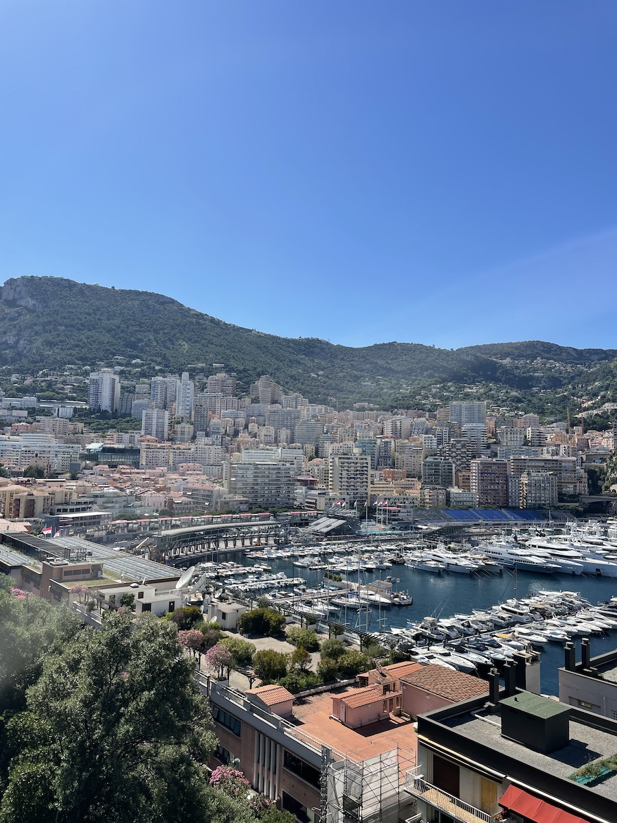 Port with boats and buildings uphill on mountain