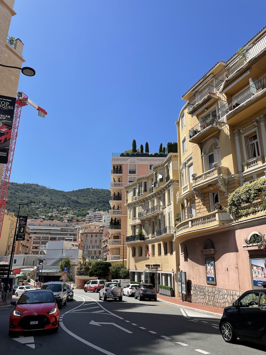 Stylish pink and yellow buildings on uphill street