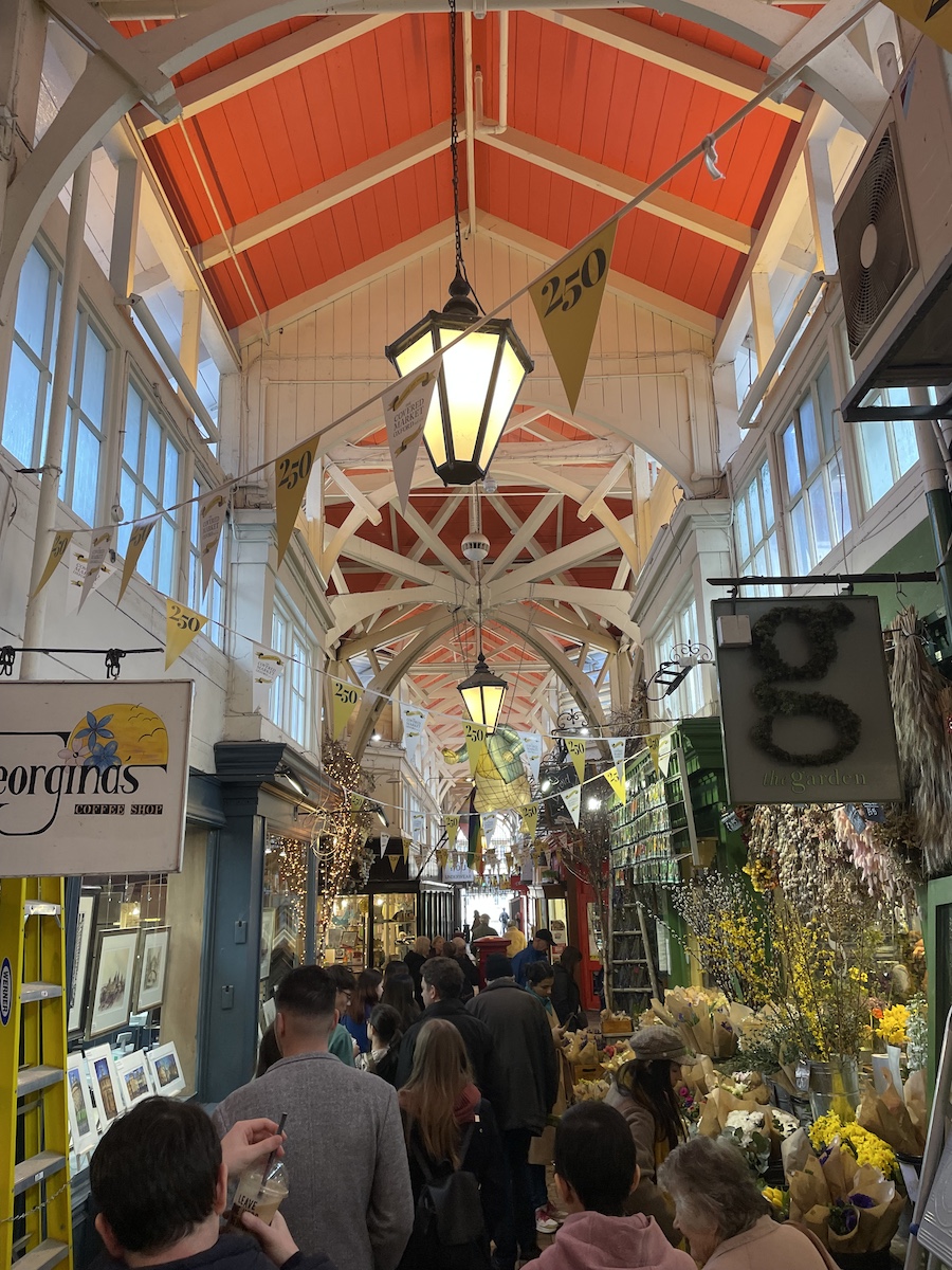 Hallway of Market with store signs, orange ceiling