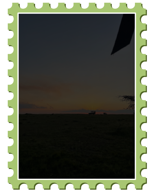 Silhouette of jeep during sunset on safari, tinted black to display text