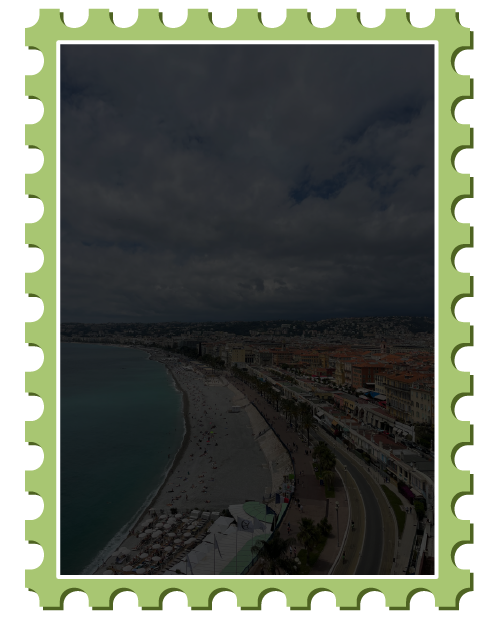 View of Nice coast and orange roof buildings from elevated hill, tinted black to display text